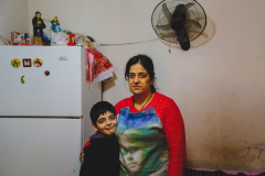 Montaha with her son  Dany in their precarious housing, Christian Iraqi refugees, Beirut, Lebanon