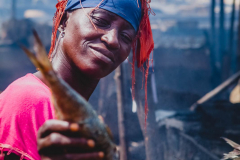 12 July 2014,  woman smoking the fish
