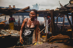 12 July 2014,  woman smoking the fish