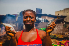 12 July 2014,  woman smoking the fish